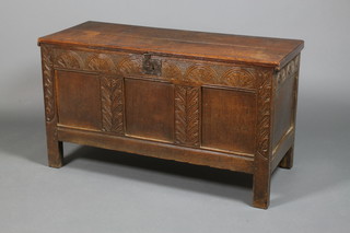 A 19th Century carved oak panel front coffer on straight legs 26"h x 46"w x 19"d 
