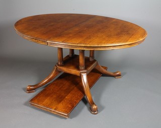 An 18th Century style oval oak extending dining table with 1 extra leaf 19.5"w, raised on pillar and quadripartite base 30"h 44"w 60"d 