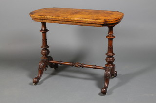 A mid Victorian inlaid figured walnut swivel top card table on carved baluster supports and scroll legs 28" x 36" x 72" ILLUSTRATED