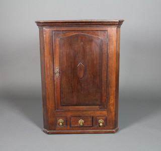 A Georgian oak hanging corner cupboard with panelled door and 3 small drawers x 30"w x 17"d 