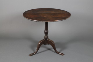 A Georgian oak circular tripod table 