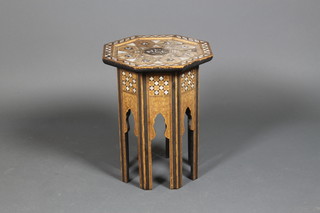 An Arab octagonal mother of pearl inlaid occasional table on pierced legs 16"