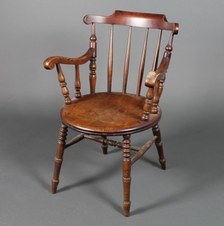 A Victorian mahogany captains elbow chair on turned legs