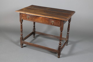 A 19th Century oak side table with 1 long drawer, raised on turned legs with straight stretchers 27"h x 35"w x 23"d 