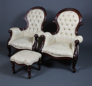 A pair of Victorian style show frame carved mahogany balloon back armchairs on scroll legs and a similar stool