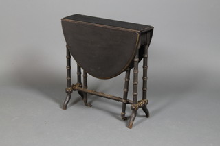 An Edwardian ebonised Sutherland table on turned legs 24"h x 23" x 32"