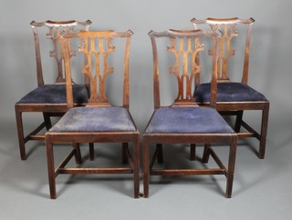 A set of 4 Georgian style mahogany pierced back dining chairs with drop in seats on square legs