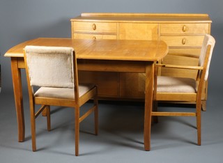 Gordon Russell, a stylish 1960's dining suite comprising of sideboard with 4 short drawers and 3 cupboard doors on splayed legs 36" x 55" x 19", a set of 6, 2 with arms, dining chairs with drop in seats and an extending dining 30" x 65" x 31" ILLUSTRATED