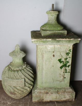 A composition square column surmounted by a swirl wall urn with floral finial 88" x 26" 