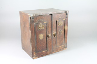 An Edwardian oak novelty smokers companion in the form of a safe 12" 