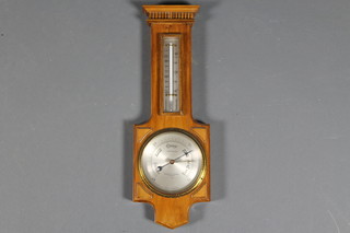 An Art Deco barometer/thermometer contained in a walnut case
