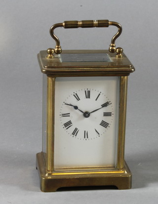 A brass cased carriage timepiece, 5.5" to handle 