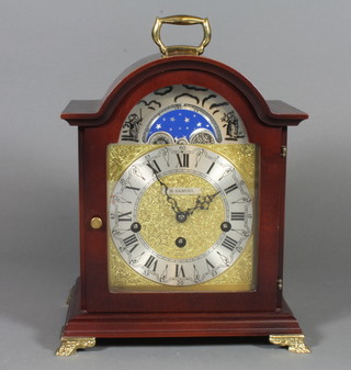 A Georgian style mahogany cased bracket clock with moon phase dial, on brass feet, 11" to handle