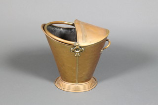 A brass helmet shaped coal scuttle 