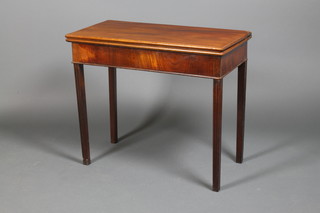 A George III mahogany tea table, raised on chamfered legs 29" x 34" x 17"