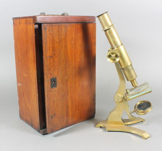 A students brass single pillar microscope with mahogany carrying  case