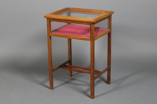 An early 20th Century mahogany bijouterie table, raised on square legs 28" x 19.5" x 16"