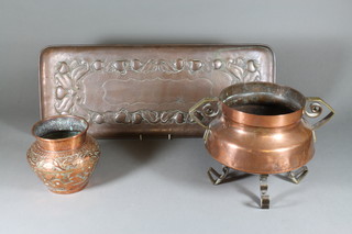An Art Nouveau circular copper and brass twin handled jardiniÃ¨re, hole to base 8", a rectangular Art Nouveau embossed copper bottle tray 23" and an Eastern embossed copper jardiniere 5.5"