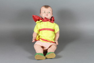 A mid 20th Century composite boy baby doll with fixed eyes  and later costume