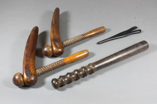 A pair of wooden shoe trees, wooden glove stretchers and a  turned wooden truncheon