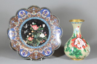 A Japanese cloisonnÃ© black ground charger with lobed borders decorated flowers 14", some damage, together with a Japanese club shaped cloisonnÃ© vase with floral decoration 10" 