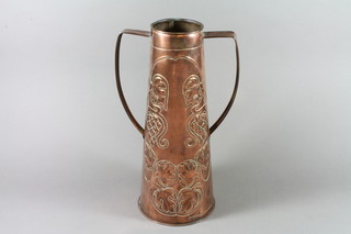 An Art Nouveau cylindrical embossed copper twin handled urn with floral decoration 15"  ILLUSTRATED