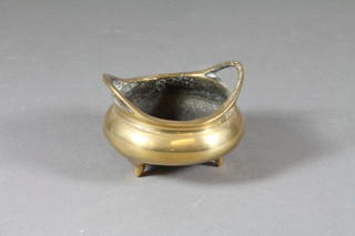 A Chinese polished bronze twin handled censer, raised on 3 feet,  the base with seal mark 2.5"