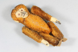 An articulated figure of a standing monkey 4.5"