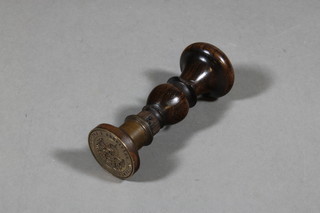 A 19th Century Continental brass and rosewood seal with coat of arms