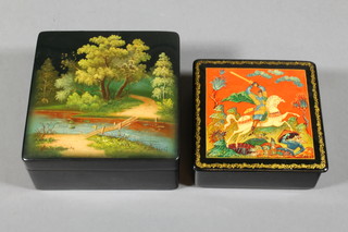 A Russian black lacquered box the lid decorated a stream and bridge 4" and 1 other decorated a knight 4"