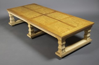 A Continental parquetry walnut rectangular coffee table, raised on a carved painted base 15" x 72" x 30"