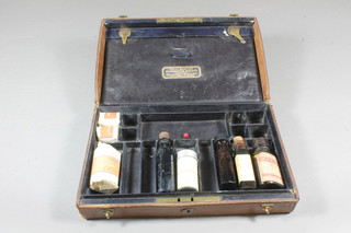 A Victorian rectangular leather bound travelling medical box, the  fitted interior containing various medical bottles, dressings etc