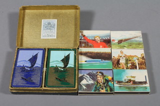 A set of George VI Delarue playing cards and 6 match boxes decorated Great British Achievements
