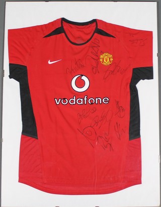 A Manchester United shirt with Vodaphone sponsor logo, signed by Ryan Giggs, Paul Scholes and others