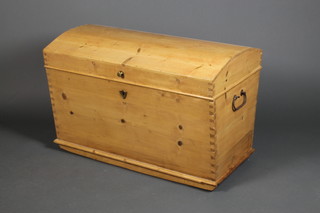 A pine dome topped trunk with carrying handles, 26" x 39" x 28"