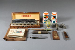 A cased Hohner harmonica and minor items