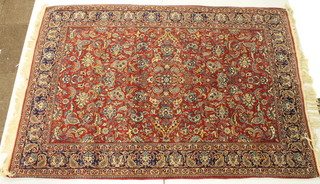 A red ground Persian carpet 59" x 60"