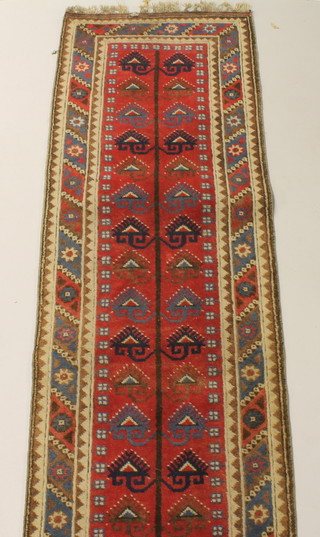 A red ground "Afghan" runner with multi-row border 116" x 30"