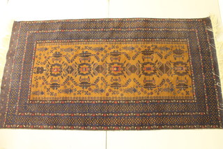 A brown ground Belouch rug the central field with multi-row borders 57" x 46"