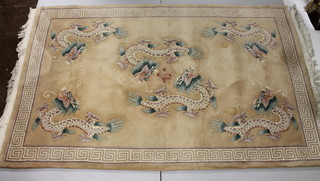 A cream coloured Chinese carpet decorated dragons 197" x 60"