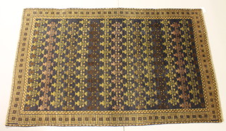 A Persian rug with all-over geometric design 72"  x 44" 
