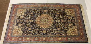 A Persian blue ground rug with central medallion 55" x 49" 