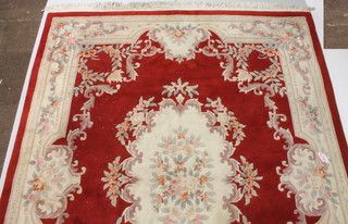 A white and floral patterned Chinese carpet with central medallion 122" x 96" 
