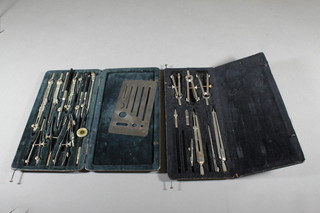 2 cased sets of drawing instruments