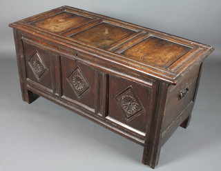 An 18th Century oak coffer of panelled construction and with hinged lid 25" x 26" x 21"