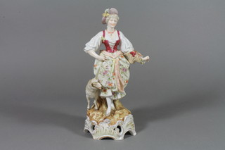 A 19th Century figure of a shepherdess holding a basket of flowers 10.5", f, 