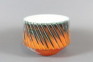 A circular orange glazed Poole Pottery vase marked Poole  England 92 5"