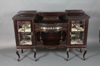 A Victorian mahogany sideboard chiffonier, the centre section fitted 1 long drawer above a recess, flanked by a pair of   cupboards, raised on cabriole supports 31"h x 59"w x 17"d
