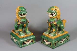 A pair of Chinese slip glaze figures of Shi Shi 10"