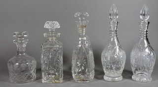 A pair of mallet shaped cut glass decanters 13" and 3 others